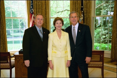 President George W. Bush and Laura Bush congratulate 2003 Maine Teacher of the Year Gerald J. Hoefs in the Oval Office Wednesday, April 30, 2003. White House Photo by Eric Draper