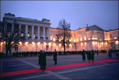 President George W. Bush and Lithuanian President Valdas Adamkus stand at attention during a welcoming ceremony at the Prezidentura, the Presidential Palace, in Vilnius, Lithuania, Nov. 23, 2002. A former Chicago-area resident and U.S. environmental regulator, President Adamkus was elected to office in 1998. White House photo by Paul Morse