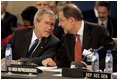 President George W. Bush speaks with European Union High Representative Javier Solana during a plenary session of the North Atlantic Council at NATO Headquarters in Brussels Tuesday, Feb. 22, 2005. 