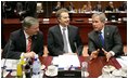 During a meeting with European Union Leaders at the EU Council Building in Brussels, President George W. Bush talks with Austrian Chancellor Wolfgang Schuessel, left, of Austria, and Prime Minister Blair of Britain,Tuesday, Feb. 22, 2005.