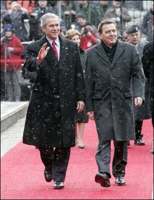 President George W. Bush and German Chancellor Gerhard Schroeder wave to the crowd during an official arrival ceremony at the Electoral Palace in Mainz, Germany, Wednesday, Feb. 23, 2005.
