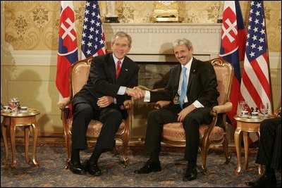Prime Minister Mikulas Dzurinda of Slovakia welcomes President George W. Bush in Bratislava, Slovakia, February 24, 2005.