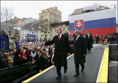 President George W. Bush gives his thumbs up as he leaves the stage with Prime Minister Mikulas Dzurinda of Slovakia after speaking at Hviezdoslavovo Square in Bratislava, Slovak Republic, Thursday, Feb. 24, 2005.