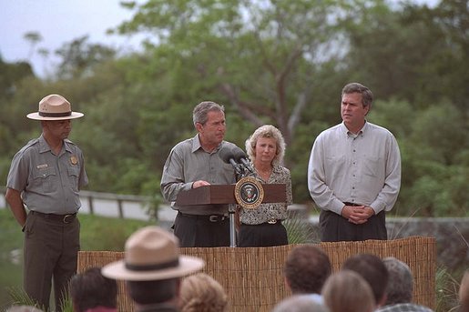 As his brother, Florida Governor Jeb Bush stands by his side, President George W. Bush speaks at the Royal Palm Visitors Center at Everglades National Park, Fla., June 4, 2001. White House photo by Eric Draper.