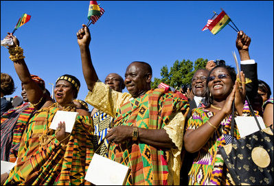 Guests in traditional Ghanaian dress celebrate the arrival of President John Agyekum Kufuor of Ghana to the White House Monday, Sept. 15, 2008, during a South Lawn Arrival Ceremony.
