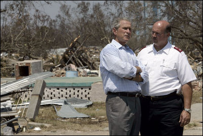 President Bush talks with an official from the Salvation Army during a walking tour of Biloxi, Miss., Sept. 2, 2005. 