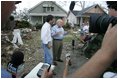 Vice President Dick Cheney walks with Mayor Gregg Warr, Thursday, Sept. 8, 2005, through a neighborhood in Gulfport, Miss., devastated by Hurricane Katrina, as they talk with surviving residents.
