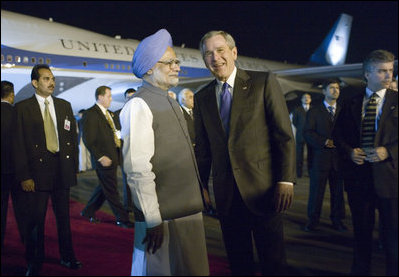 President George W. Bush is welcomed to India by Indian Prime Minister Manmohan Singh upon Air Force One's arrival Wednesday, March 1, 2006, at Indira Gandhi International Airport. The President and First Lady are scheduled to spend three days in the country before flying to Pakistan.