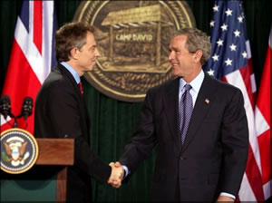 President George W. Bush speaks with British Prime Minister Tony Blair.
