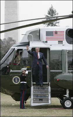 President George W. Bush waves as he exits Marine One upon the arrival Wednesday, March 14, 2007, of he and Mrs. Laura Bush on the South Lawn following their six-day, five-country Latin American visit. White House photo by Joyce Boghosian