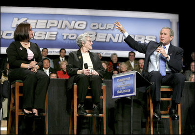 President George W. Bush talks with grandmother Margaret Valdez, center, and her granddaughter Jessica Valdez during a Conversation on Strengthening Social Security in Albuquerque, N.M., Tuesday, March 23, 2005.
