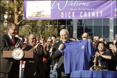 After congratulating NASA staff on the successful landing of the robotic rover Spirit on Mars, Vice President Dick Cheney holds up a shirt bearing the Spirit emblem at the Jet Propulsion Laboratory in Pasedena, Calif., Jan. 14, 2004.