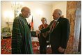 Vice President Dick Cheney shakes hands with newly-elected President Hamid Karzai of Afghanistan before departing Kabul, Afghanistan, Dec. 7, 2004. Vice President Dick Cheney and Lynne Cheney flew to Afghanistan to attend the historic swearing-in ceremony of President Karzai.