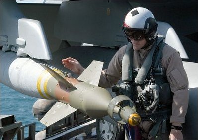 The Arabian Gulf (Apr. 2, 2003) – A Naval Aviator inspects ordnance on an F/A-18F Super Hornet prior to taking off on his next mission aboard USS Abraham Lincoln (CVN 72). U.S. Navy photo by Photographer's Mate 3rd Class Tyler J. Clements