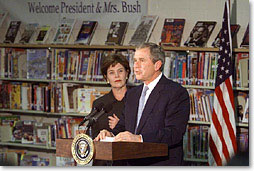 President George W. Bush speaks with the First Lady Laura Bush at Moline Elementary School in St.Louis, Missouri on February 20 2001. (White House Photo by Paul Morse)