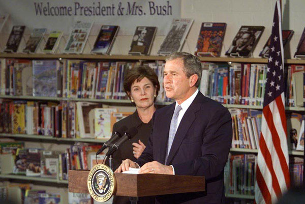 President George W. Bush speaks with the First Lady Laura Bush at Moline Elementary School in St.Louis, Missouri on February 20 2001. WHITE HOUSE PHOTO BY PAUL MORSE.
