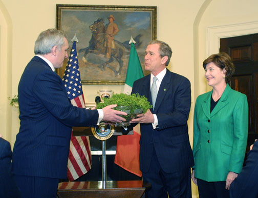 Irish Prime Minister Bertie Ahern presents a shamrock plant to President George Bush and First Lady Laura Bush.