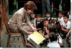 Laura Bush reads to a group of second-graders in the library of Morningside Elementary School in San Fernando, Calif., March 22, 2001.  White House photo by Paul Morse
