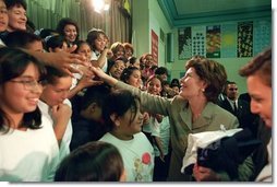 Laura Bush greets student of Morningside Elementary School after addressing the assembly in San Fernando, Calif., March 22, 2001.  White House photo by Paul Morse