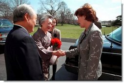 Laura Bush greets Ambassador and Mrs. Shunji Yanai of Japan before departing for the 2001 Cherry Blossom Festival March 25, 2001.  White House photo by Paul Morse