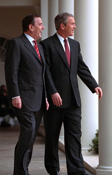 President George W. Bush walks with German Chancellor Gerhard Schroeder at the White House on Thursday March 29. 2001.
