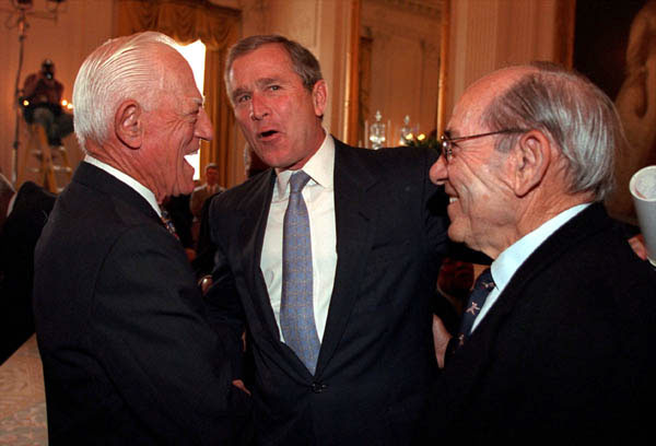 President George W. Bush chats with Hall of Famer’s Sparky Anderson, left, and Yogi Berra in a ceremony in the East Room of the White House on March 30, 2001.
