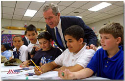 President George W. Bush talks with students at B.W. Tinker School in Waterbury, Connecticut on April 18, 2001.