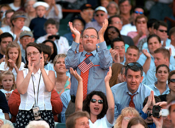 An enthusiastic crowd greets President Bush's remarks about tax relief at Zephyr Field in New Orleans, Louisiana.