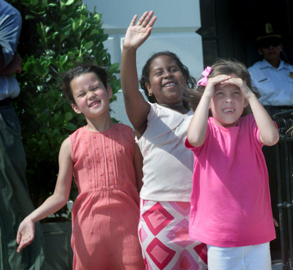 Students from The Potomac School First Grade Class reacts as Marine One departs the South Lawn following their 