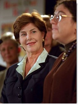 Laura Bush listens to remarks by Dr. Perri Klass during a Read Out and Read event in Boston, Mass., June 1, 2001.  White House photo by Paul Morse
