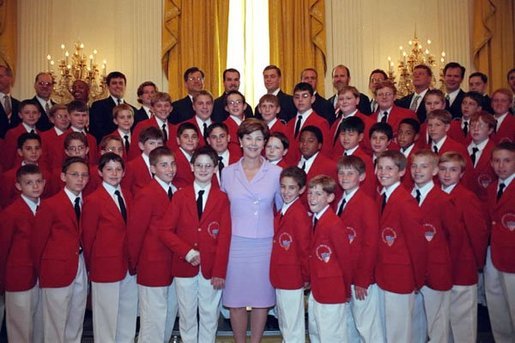 Laura Bush poses with the Philadelphia Boys Choir following their performance at the Senate Spouses Luncheon in the East Room June 4, 2001. White House photo by Susan Sterner.