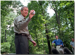 President Bush and Prime Minister Koizumi of Japan toss around a baseball for the press during a visit to Camp David June 30, 2001.