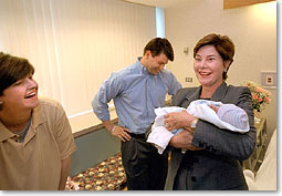President Bush and First Lady Laura Bush visit Desiree and Stephen Sayle at Inova Fair Oaks Hospital July 3, 2001. Mrs. Sayle, who is the First Lady's Director of Correspondence, recently gave birth to her second daughter, Vivienne. White House photo by Eric Draper.