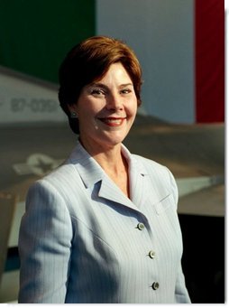 Laura Bush arrives to a Troops to Teachers meeting and rally in the Hangar One at the U.S. air base in Aviano, Italy, July 20, 2001.  White House photo by Moreen Ishikawa
