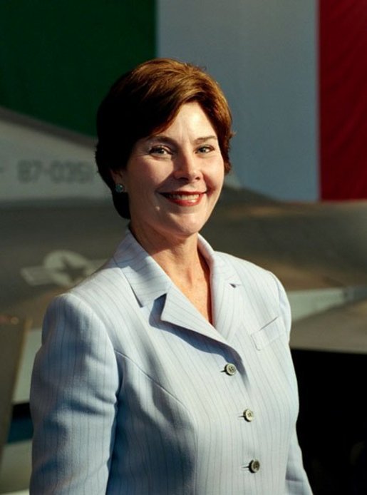 Laura Bush arrives to a Troops to Teachers meeting and rally in the Hangar One at the U.S. air base in Aviano, Italy, July 20, 2001. White House photo by Moreen Ishikawa.