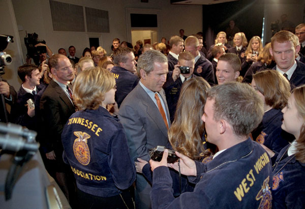 Tilling it up with members of Future Farmers of America, President Bush wades into an enthusiastic crowd after addressing 100 representatives the Friday, July 27, 2001. White House photo by Eric Draper.