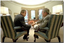 President Bush and Representative Charles Norwood seal their negotiations over the Patient's Bill of Rights in the Oval Office late afternoon Wednesday August 1, 2001. Shortly thereafter, the President and Rep. Norwood gave a press briefing announcing their agreement. White House photo by Eric Draper.