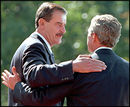President Fox and President Bush greet each other at the State Arrival Ceremony.