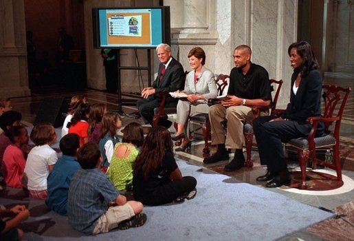 Librarian of Congress, James Billington, Mrs. Bush, Orlando Magic Grant Hill and LA Sparks Lisa Leslie participate in the National Book Festival Back to School event in the Great Hall at the Library of Congress Jefferson Building Sept. 7, 2001 in Washington, D.C. White House photo by Moreen Ishikawa.