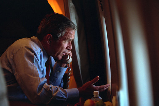 After departing Offutt Air Force Base in Nebraska, President George W. Bush confers with Vice President Dick Cheney from Air Force One during his flight to Andrews Air Force Base Sept. 11, 2001. White House photo by Eric Draper