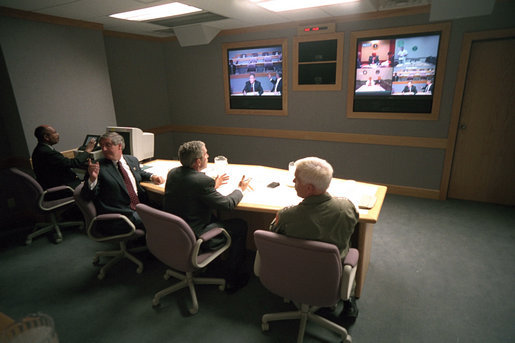 President George W. Bush, White House Chief of Staff Andy Card (left) and Admiral Richard Mies conduct a video tele-conference at Offutt Air Force Base in Nebraska, Sept. 11, 2001. White House photo by Eric Draper