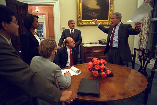 Returning from Sarasota, Fla., where he first saw news footage of the attack, President George W. Bush immediately gathers his senior staff in the private dining room off the Oval Office Sept. 11, 2001. Meeting with the President from left to right are White House Counsel Alberto Gonzales, Counselor Karen Hughes, National Security Advisor Dr. Condoleezza Rice, Press Secretary Ari Fleischer and Chief of Staff Andy Card. White House photo by Eric Draper