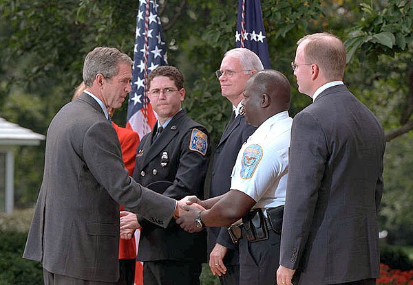 Inviting several charitable organizations to the White House Rose Garden, President Bush thanks representatives from the groups that helped with the relief effort at the World Trade Center and the Pentagon. "Last week was a really horrible week for America. But out of our tears and sadness, we saw the best of America as well. We saw a great country rise up to help," said the President in his remarks. More than 55 million dollars has been raised in one week. White House photo by Paul Morse.