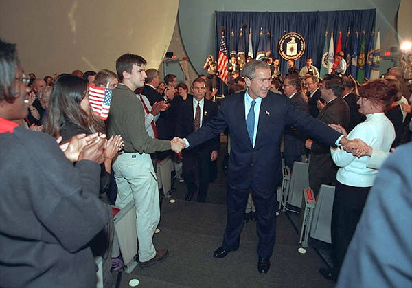 Greeted by applause and cheers, President Bush visits with CIA employees during a trip their headquarters Sept. 26. White House photo by Eric Draper.