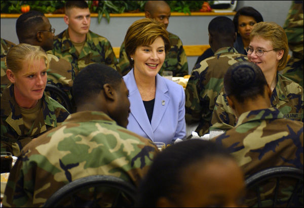Laura Bush talks with members of the 101st Airborne at Fort Campbell, Kentucky. Known as "The Screaming Eagles," this airborne division took part in the largest airborne assault of World War II and also served in Vietnam and more recently in the Balkans. White House photo by Tina Hager.