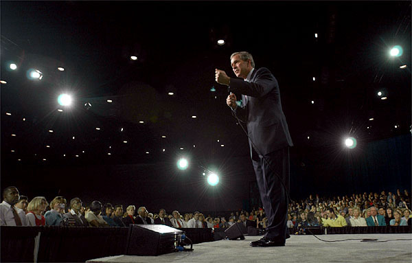 Meeting with about 4,000 displaced workers, President George W. Bush holds a town hall meeting at the Orange County Convention Center in Orlando, Fla., Tuesday, Dec. 4, 2001. White House photo by Eric Draper.