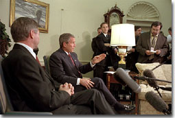 Addressing the media, President George W. Bush meets with Norwegian Prime Minister Kjell Magne Bondevik in the Oval Office of the White House, December 5, 2001. "We won't forget what took place," said President Bush, referring to the Sept. 11 terrorist attacks. "And we will bring them to justice." White House photo by Paul Morse.