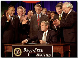 President George W. Bush signs the Drug-Free Communities Act to help individual communities fight drug abuse Dec. 14. 
