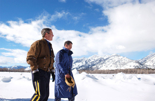 President George W. Bush and friend Roland Betts walk a private trail along the Snake River in Jackson Hole, Wyoming, Saturday, Feb. 9, 2002. The President and Mrs. Bush are staying at the Jackson Hole residence of Roland and Lois Betts. The Grand Teton Mountains are shown in background. White House photo by Eric Draper.