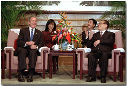 President George W. Bush and Chinese President Jiang Zemin talk during an arrival ceremony at The Great Hall of the People in Beijing, People's Republic of China, Feb. 21. White House photo by Paul Morse.